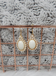 Ivory Stone Centered in Tiny Pearls Pierced Hook Dangle Earrings